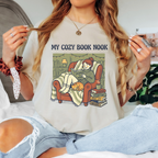 Cozy book nook shirt, reading is magic t-shirt, cottagecore book lover tee, cat and books graphic, sand colored bookish apparel